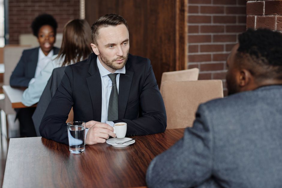 Two people talking across a table